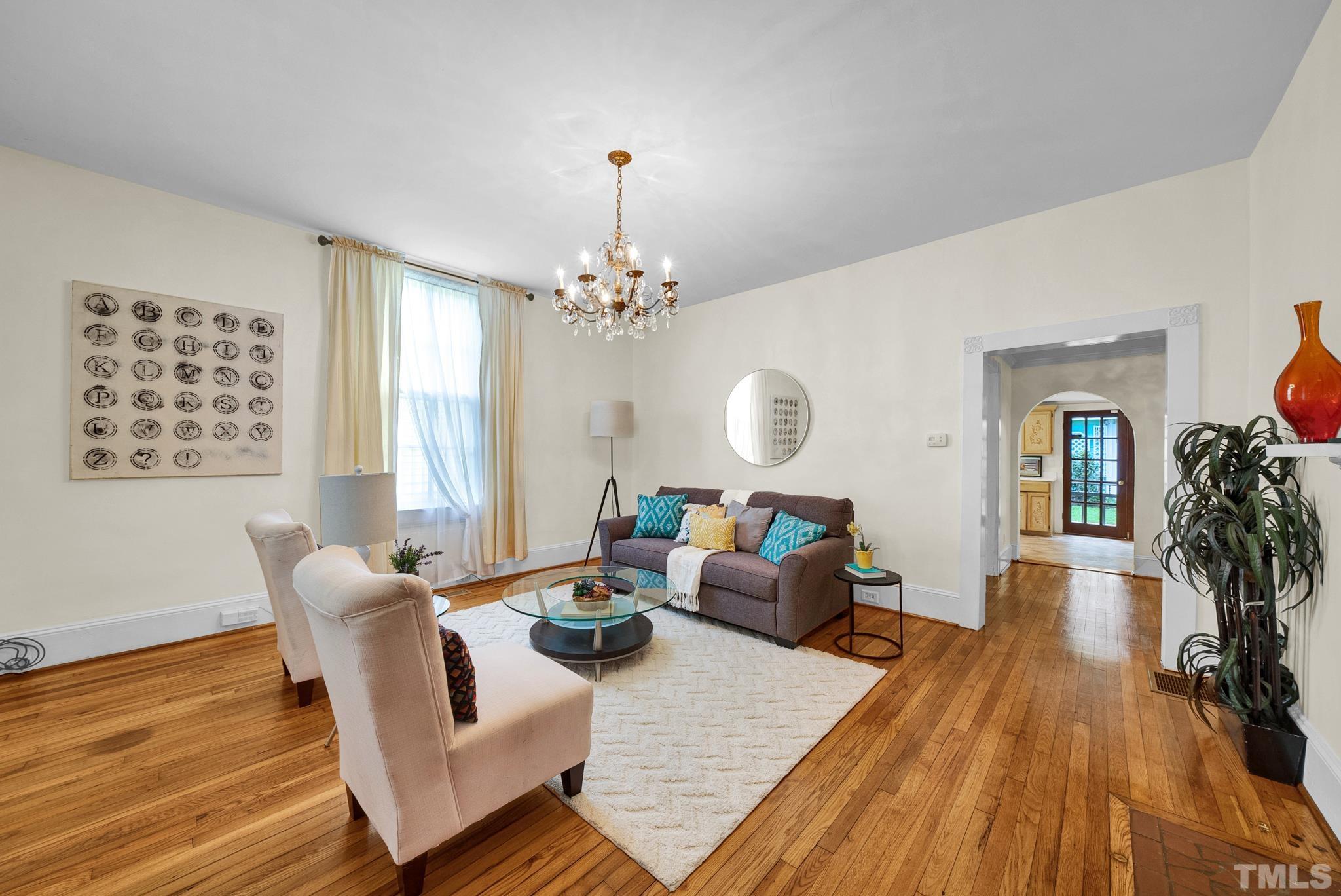 545 East Jones Street Raleigh, NC 27601 - Photo 10 of 35 a living room with furniture and wooden floor