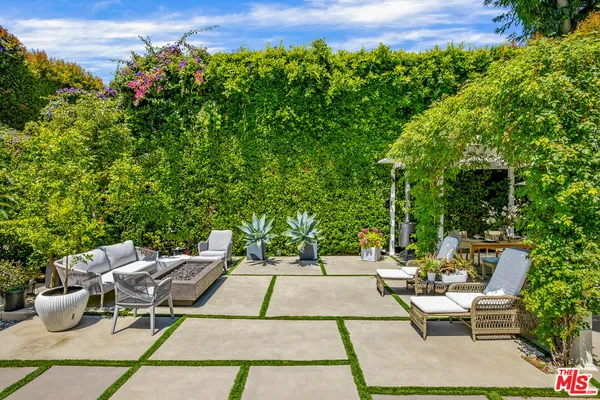 a view of backyard with seating space