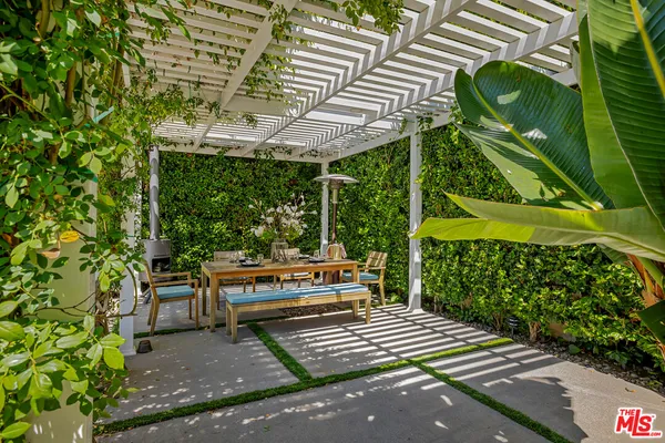 a view of a wooden bench in the patio