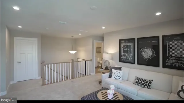 a bathroom with a toilet a sink a mirror and vanity