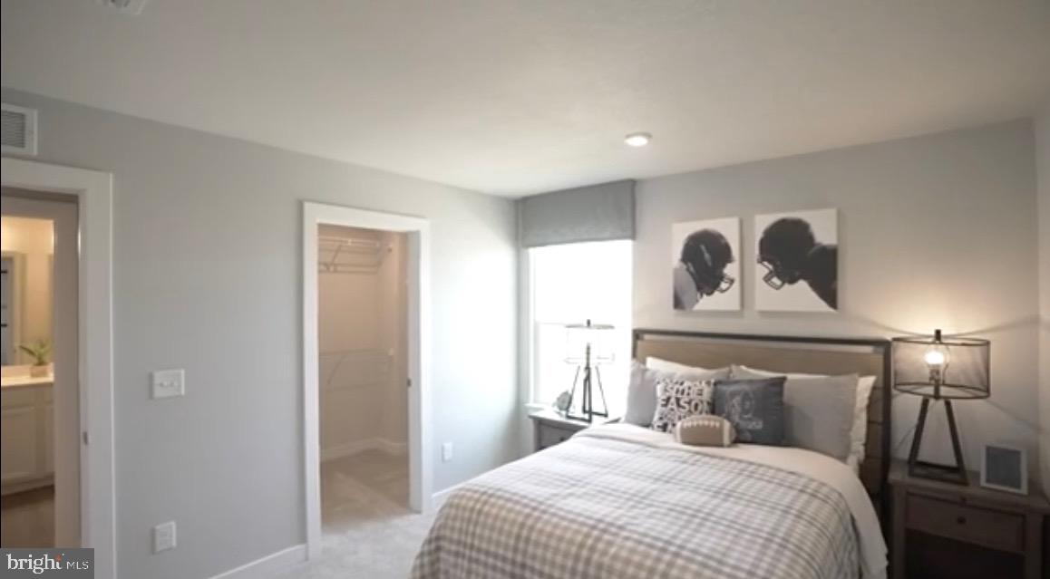 37946 Oneida Way Frankford, DE 19945 - Photo 21 of 29 a bedroom with a bed and painting on the wall