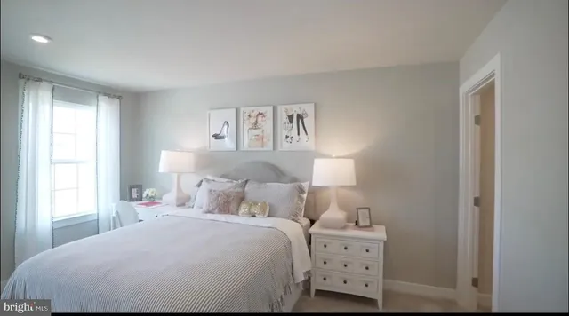 a living room with furniture a window and a table