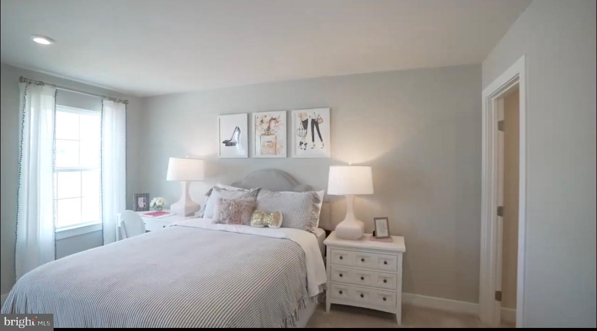 37946 Oneida Way Frankford, DE 19945 - Photo 22 of 29 a bedroom with a bed and a window