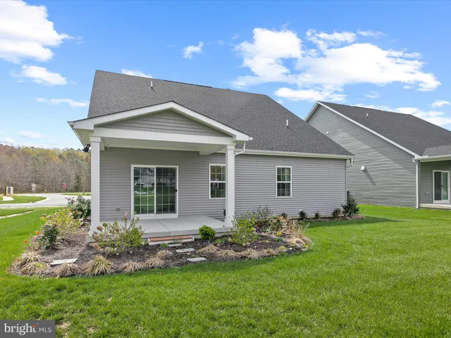 a view of house and outdoor space with yard