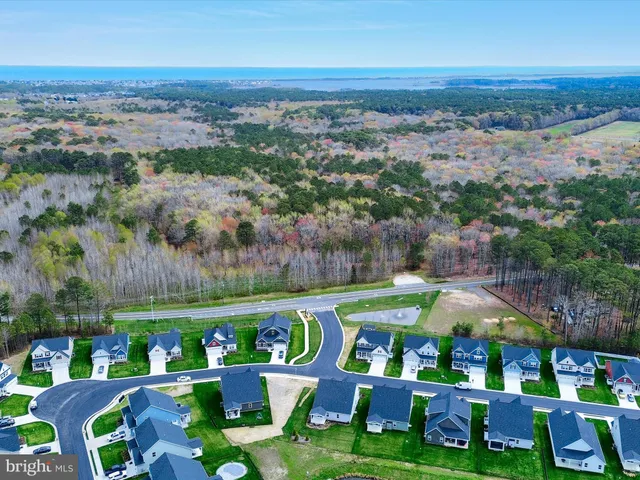 an aerial view of multiple house swimming pool outdoor seating and yard