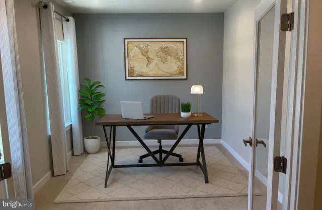 a view of a workspace with furniture