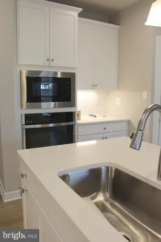 a kitchen with a sink and cabinets