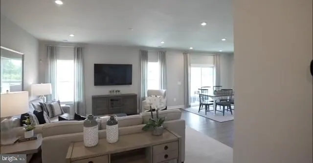 a living room with fireplace furniture and a flat screen tv