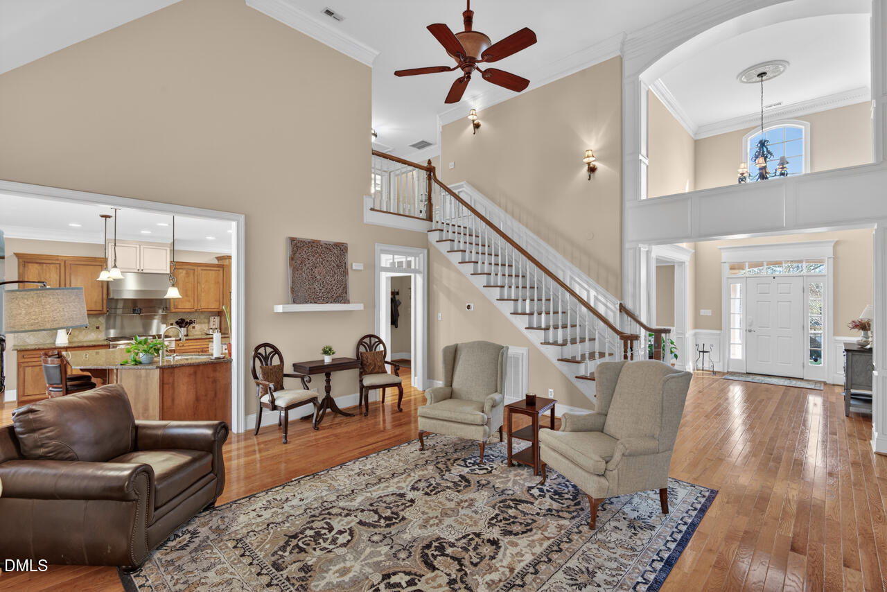 2545 Bittersweet Drive Durham, NC 27705 - Photo 14 of 91 a living room with furniture or wooden floor and a chandelier