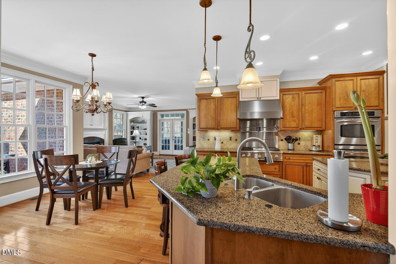 2545 Bittersweet Drive Durham, NC 27705 - Photo 18 of 91 a kitchen with stove and cabinets