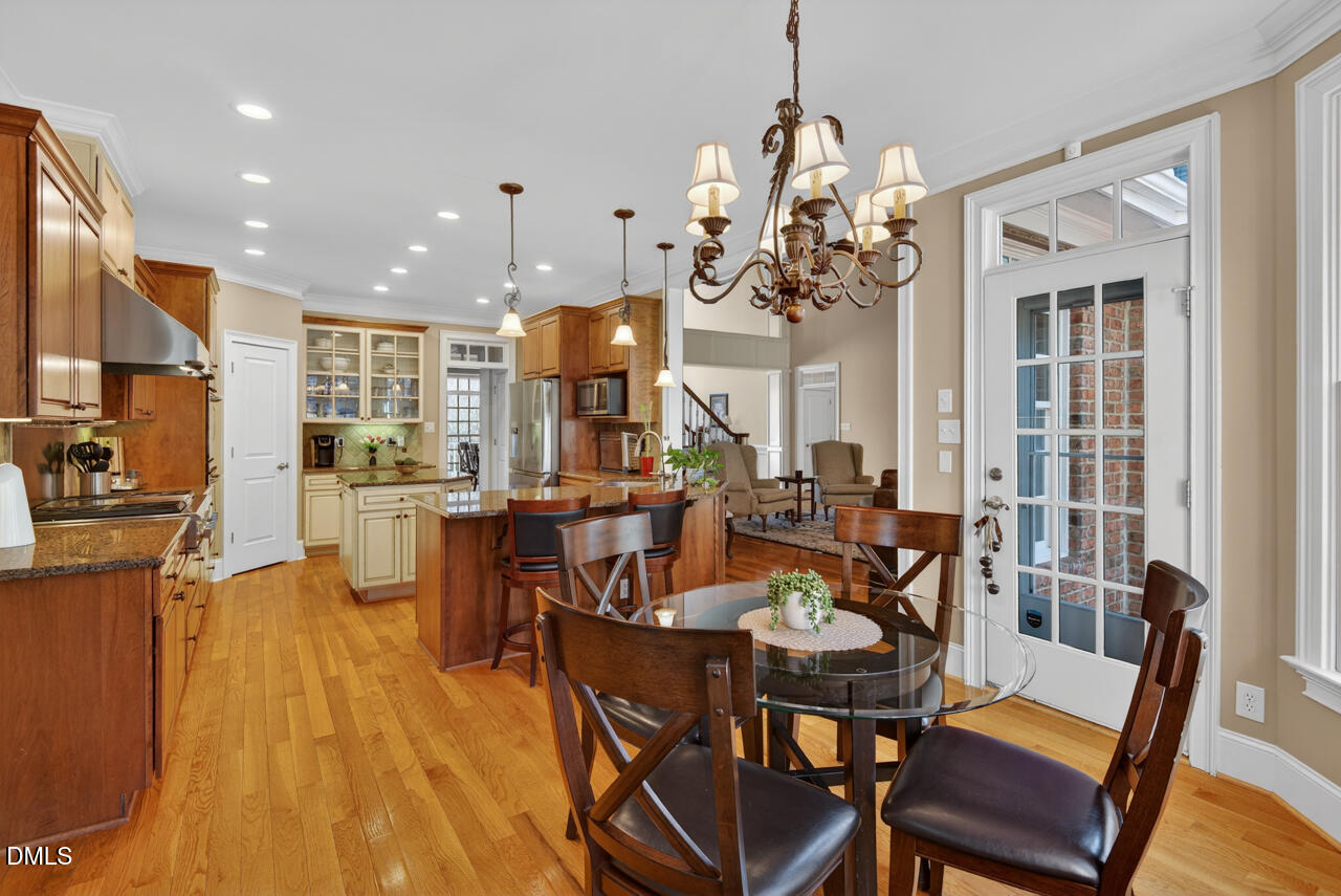 2545 Bittersweet Drive Durham, NC 27705 - Photo 25 of 91 a view of a dining room with furniture window and wooden floor