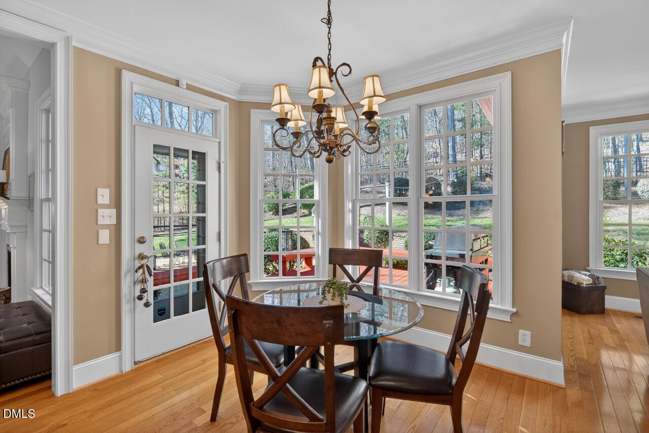 2545 Bittersweet Drive Durham, NC 27705 - Photo 26 of 91 a view of a dining room with furniture window and wooden floor