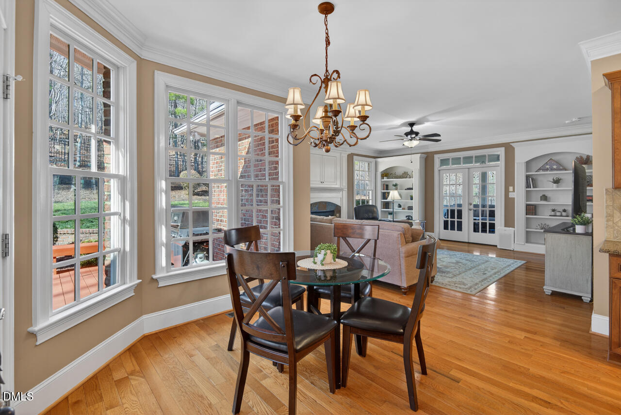 2545 Bittersweet Drive Durham, NC 27705 - Photo 31 of 91 a view of a dining room with furniture wooden floor and chandelier