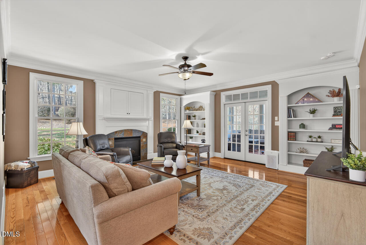 2545 Bittersweet Drive Durham, NC 27705 - Photo 33 of 91 a living room with furniture a fireplace and a table