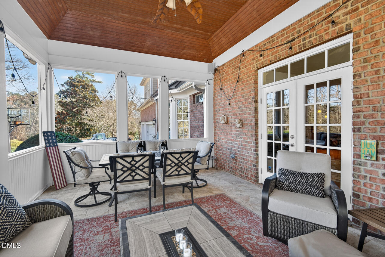 2545 Bittersweet Drive Durham, NC 27705 - Photo 40 of 91 a outdoor space with patio the couches and a dining table with the view of the balcony