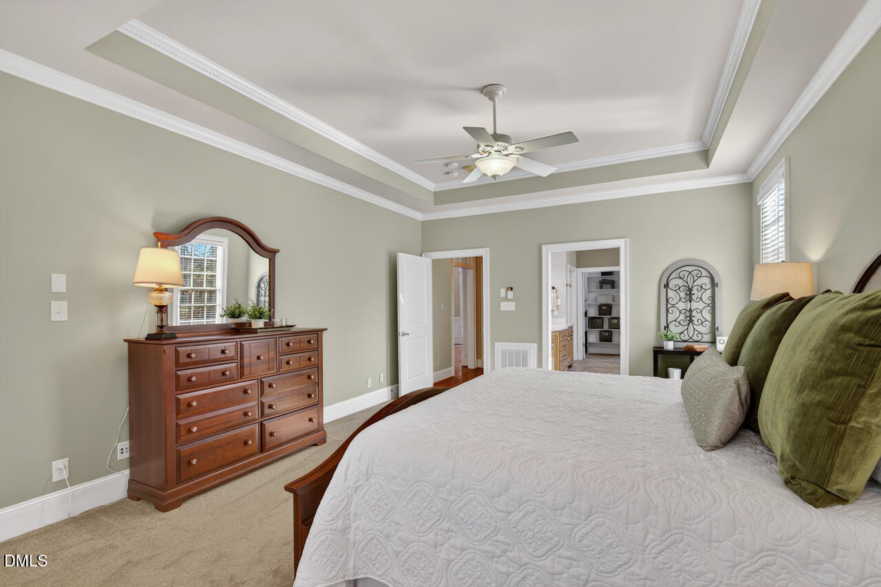 2545 Bittersweet Drive Durham, NC 27705 - Photo 43 of 91 a bedroom with a bed and dresser with mirror