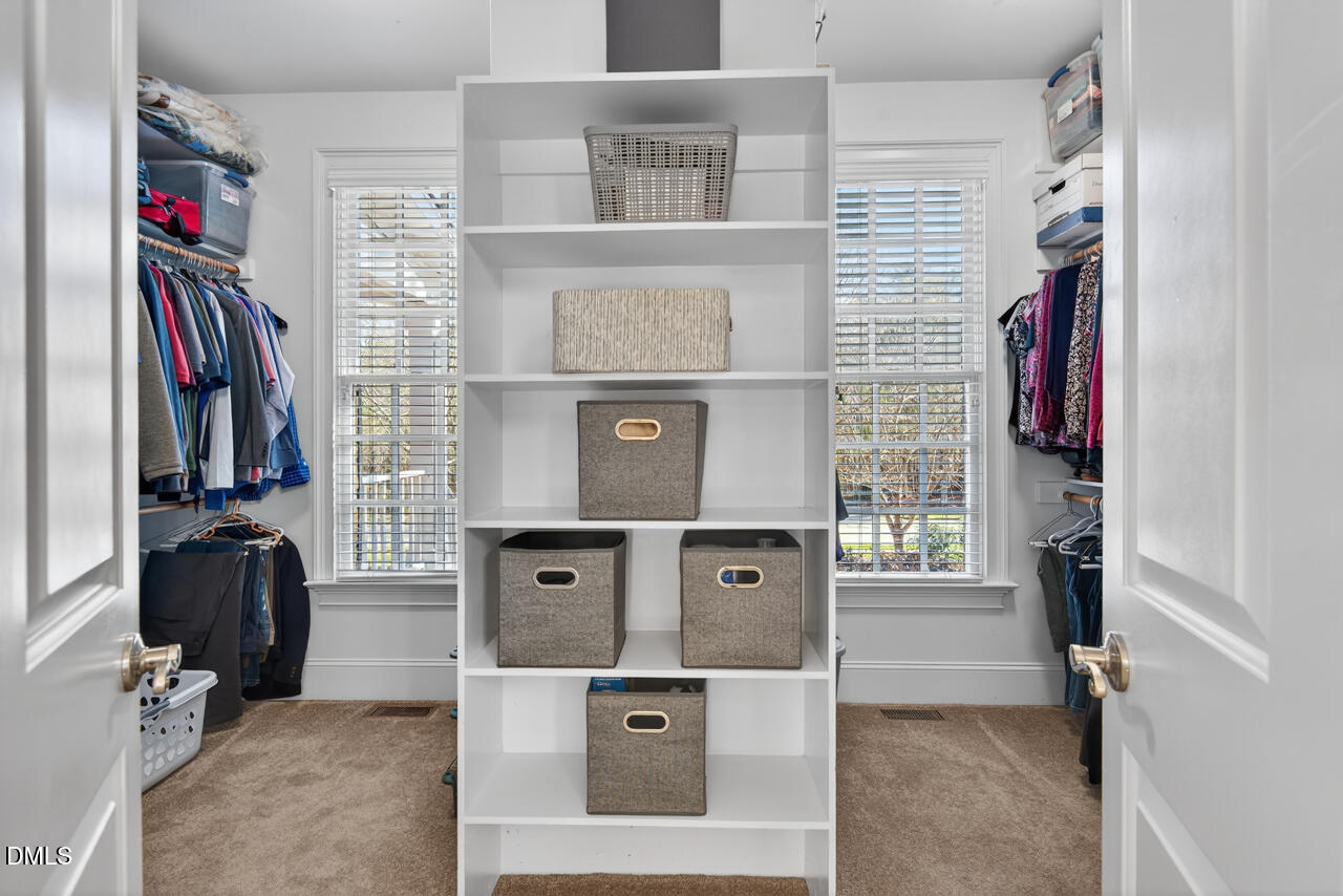2545 Bittersweet Drive Durham, NC 27705 - Photo 50 of 91 a view of walk in closet with clothes and shoes