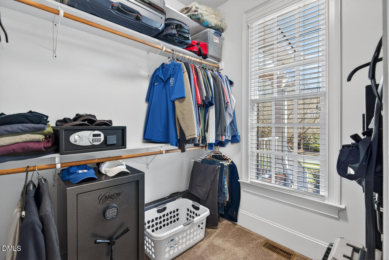 2545 Bittersweet Drive Durham, NC 27705 - Photo 52 of 91 a view of walk in closet with clothes and shoes