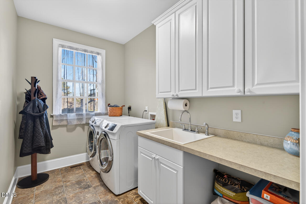 2545 Bittersweet Drive Durham, NC 27705 - Photo 53 of 91 a utility room with dryer and washer