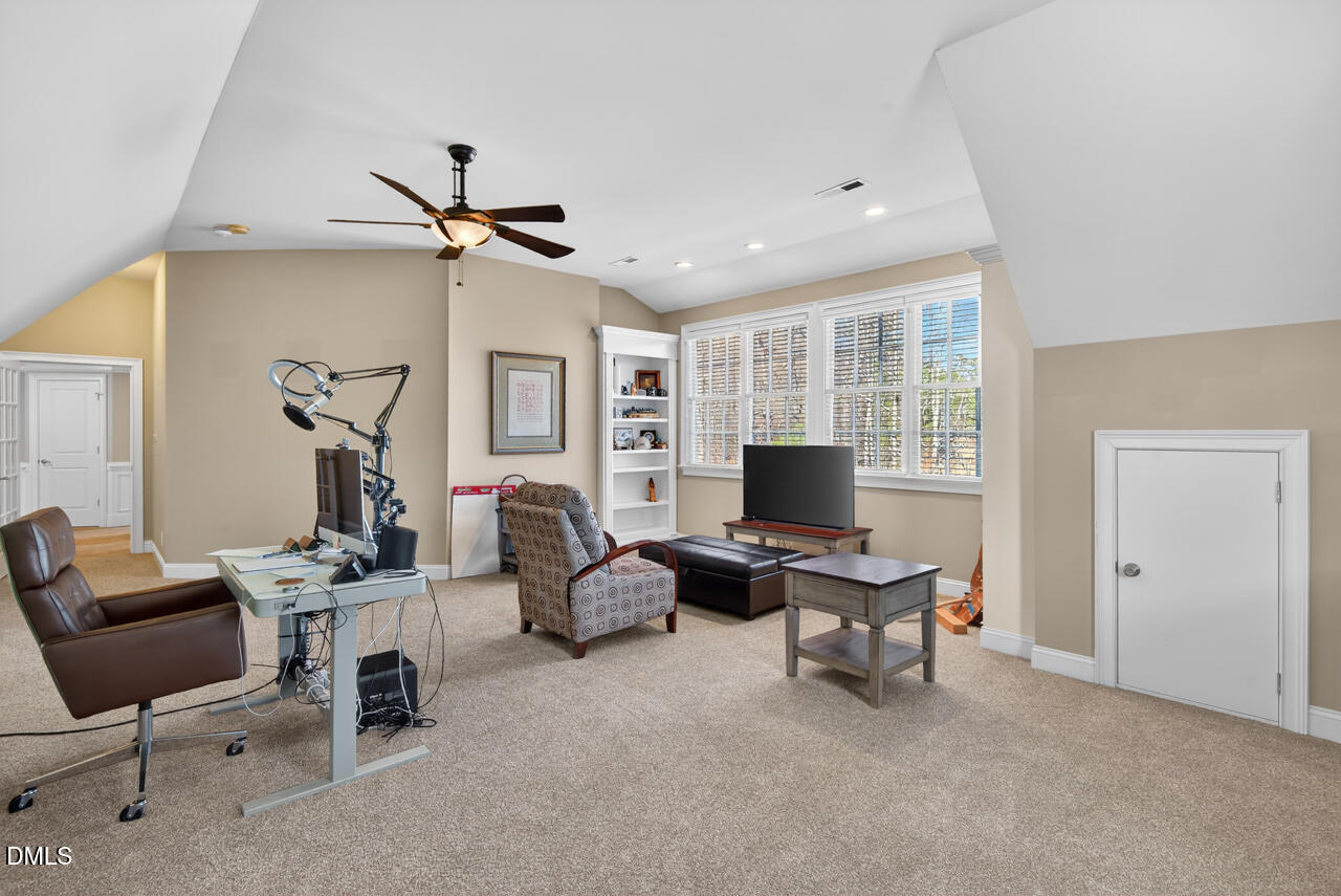 2545 Bittersweet Drive Durham, NC 27705 - Photo 62 of 91 a work room with furniture a ceiling fan and a window