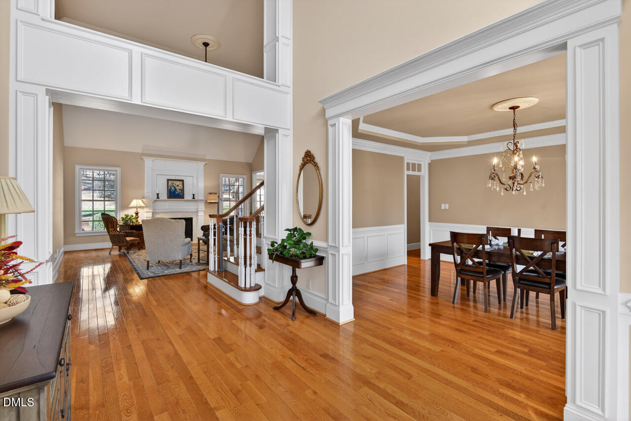 2545 Bittersweet Drive Durham, NC 27705 - Photo 7 of 91 a view of a dining room and livingroom with furniture wooden floor a chandelier