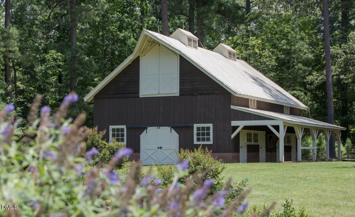 2545 Bittersweet Drive Durham, NC 27705 - Photo 87 of 91 a front view of a house with a garden