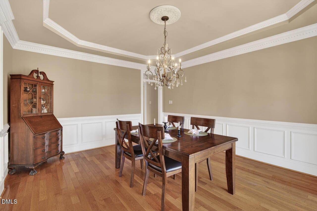 2545 Bittersweet Drive Durham, NC 27705 - Photo 9 of 91 a view of a dining room with furniture and wooden floor