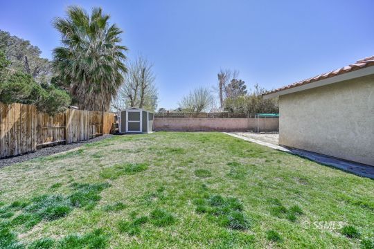 725 West Howell Avenue Ridgecrest, CA 93555 - Photo 34 of 35 a backyard of a house with palm trees