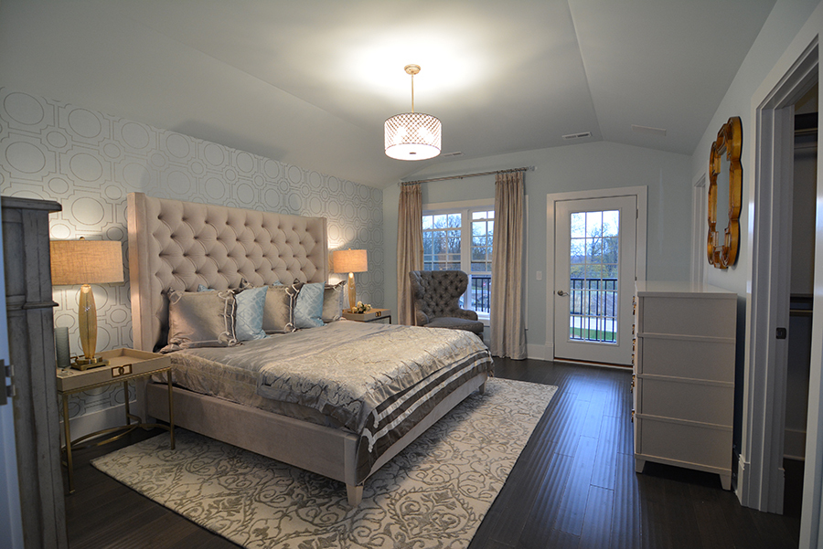 107 Stevens Street Geneva, IL 60134 - Photo 15 of 24 a bedroom with a bed and wooden floor