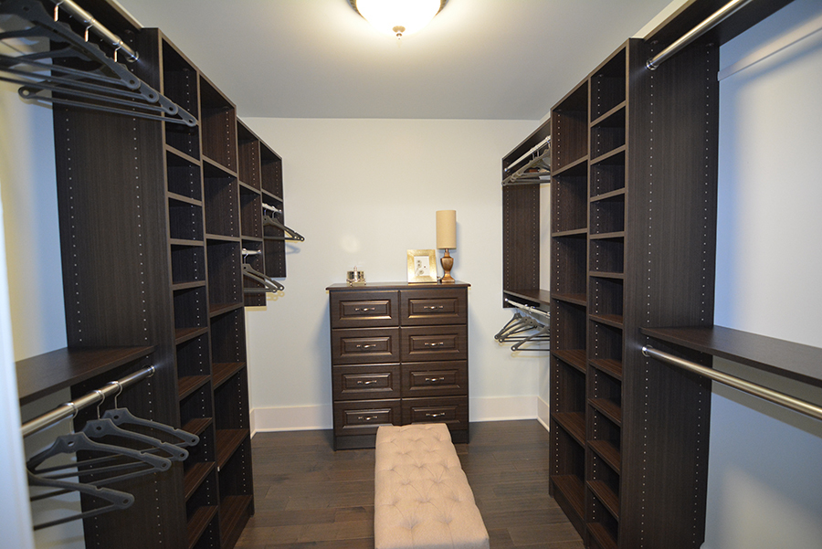 107 Stevens Street Geneva, IL 60134 - Photo 18 of 24 a view of walk in closet with clothes and shoes