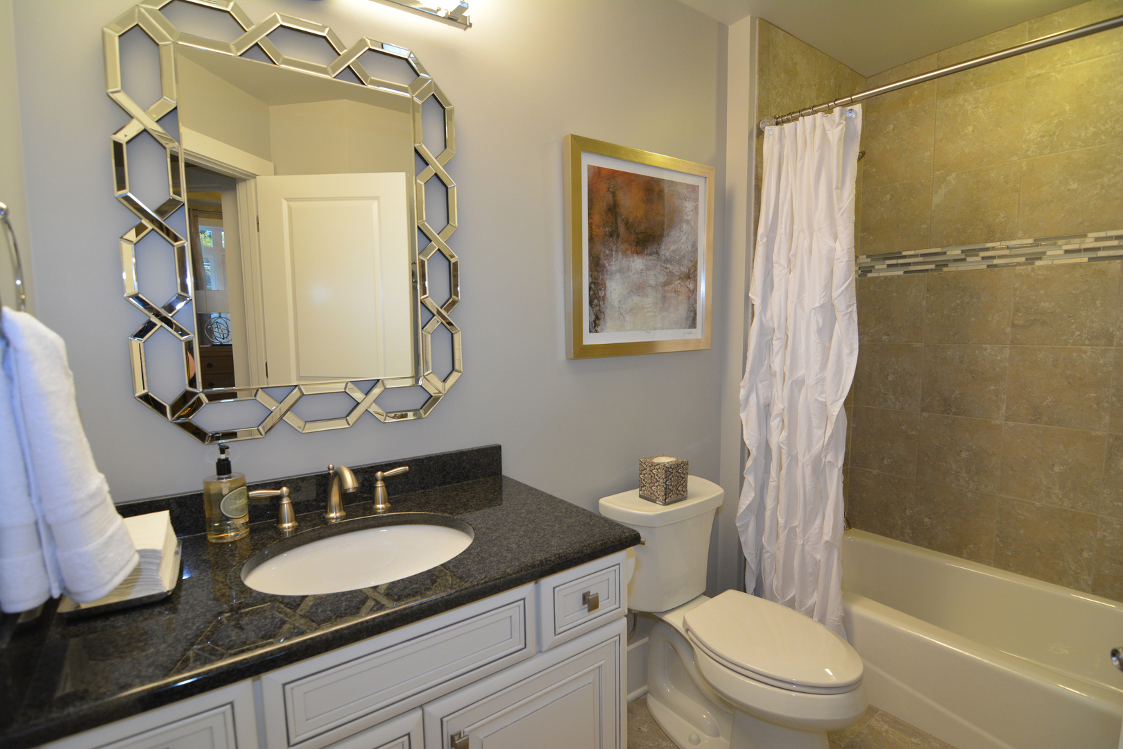 107 Stevens Street Geneva, IL 60134 - Photo 21 of 24 a bathroom with a granite countertop sink toilet and shower