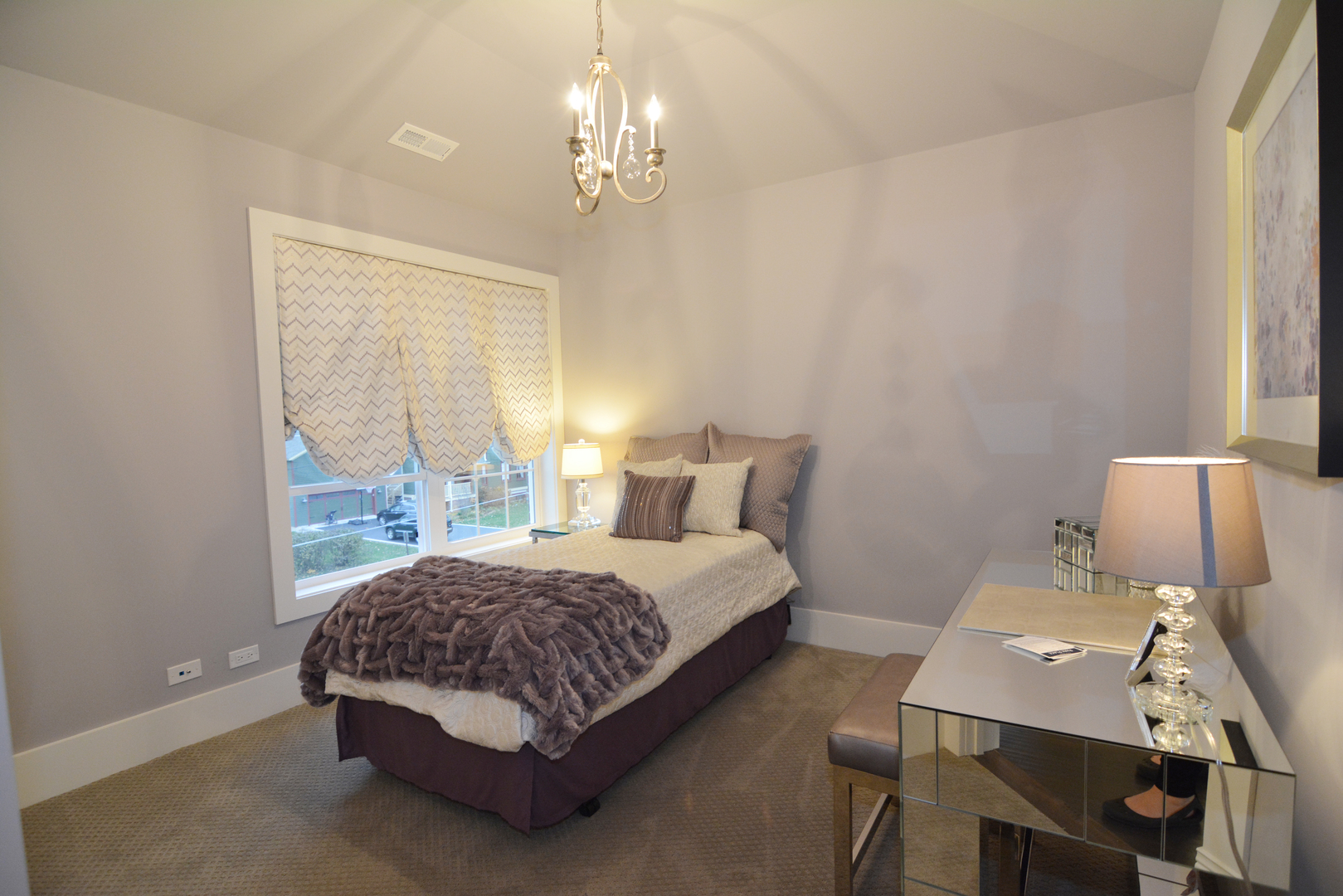 107 Stevens Street Geneva, IL 60134 - Photo 22 of 24 a spacious bedroom with a bed window and table