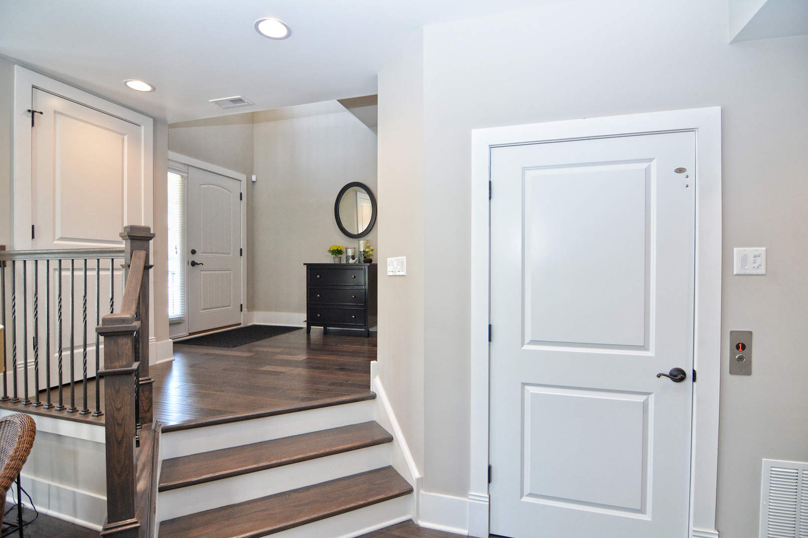 107 Stevens Street Geneva, IL 60134 - Photo 5 of 24 a view of a hallway with wooden floor and staircase