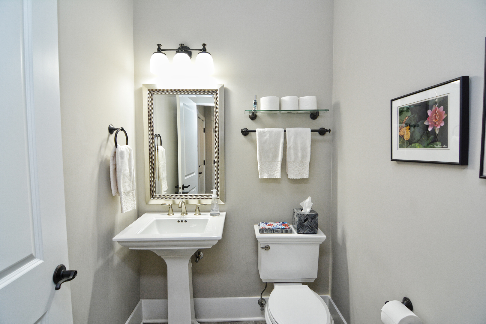 107 Stevens Street Geneva, IL 60134 - Photo 9 of 24 a bathroom with a toilet sink and mirror