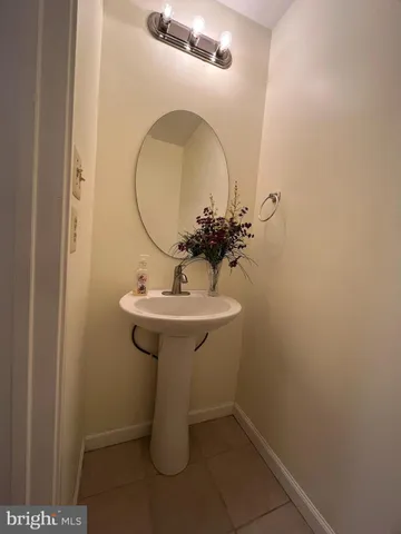 a bathroom with a sink and mirror