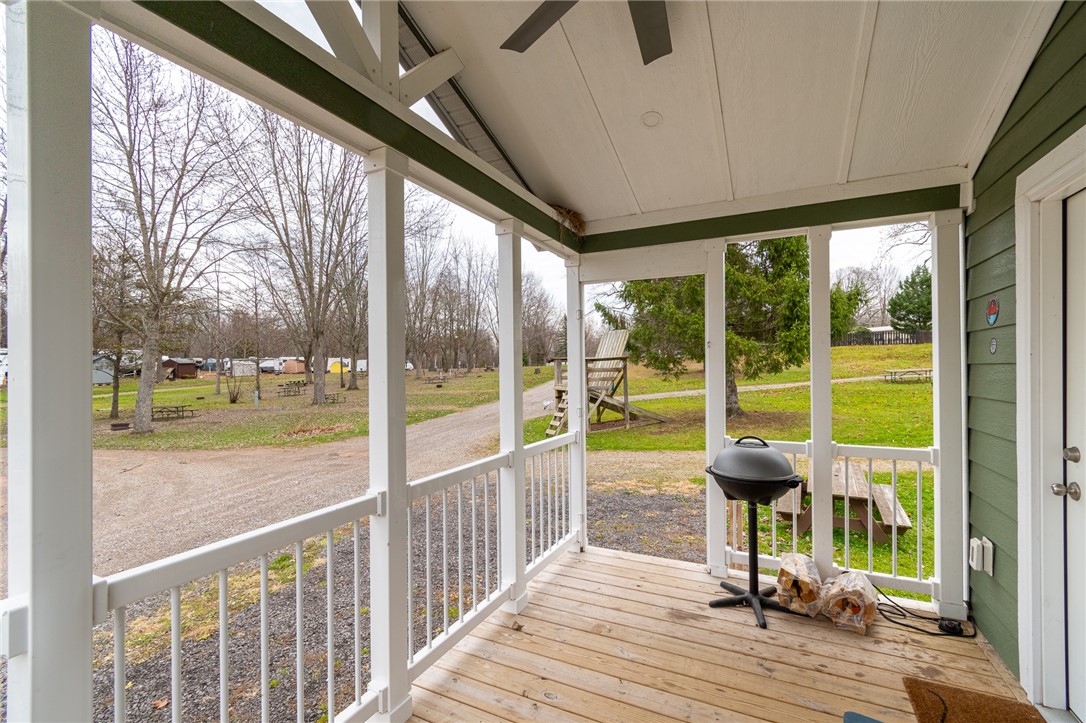 7150 Garner Road, Unit 40 Wolcott, NY 14590 - Photo 5 of 20 Enjoy quiet morning coffee on the covered porch