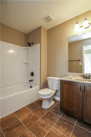 12 Chapel Ridge Road Clarksville, TN 37040 - Photo 16 of 17 a bathroom with a granite countertop sink toilet and shower