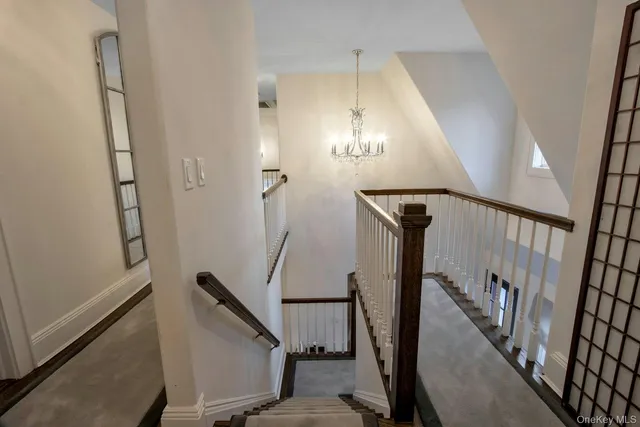 a view of a hallway with staircase