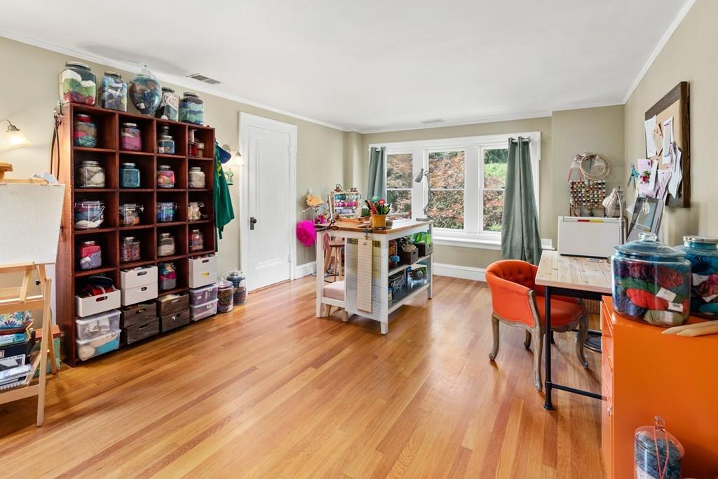 41 Ox Bow Road Weston, MA 02493 - Photo 14 of 26 a living room with furniture a rug and a book shelf