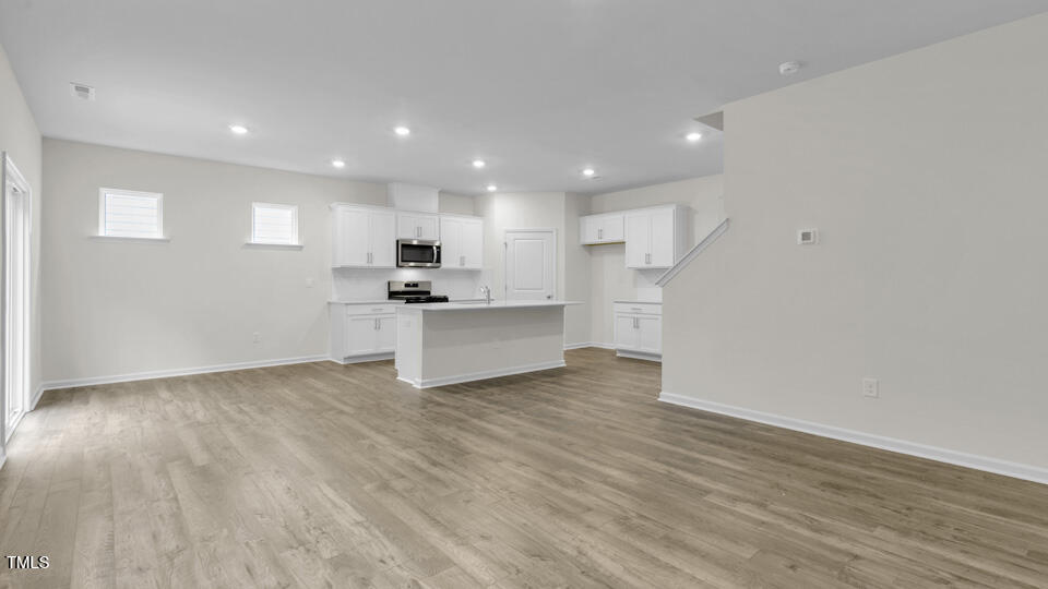 818 Comice Pear Way Willow Spring, NC 27592 - Photo 13 of 44 a view of kitchen with wooden floor