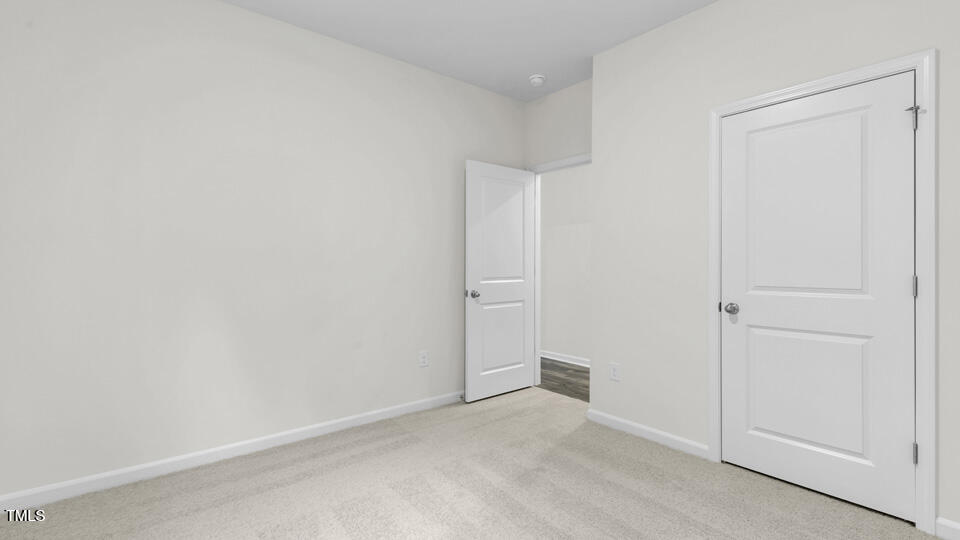 818 Comice Pear Way Willow Spring, NC 27592 - Photo 20 of 44 a view of an empty room
