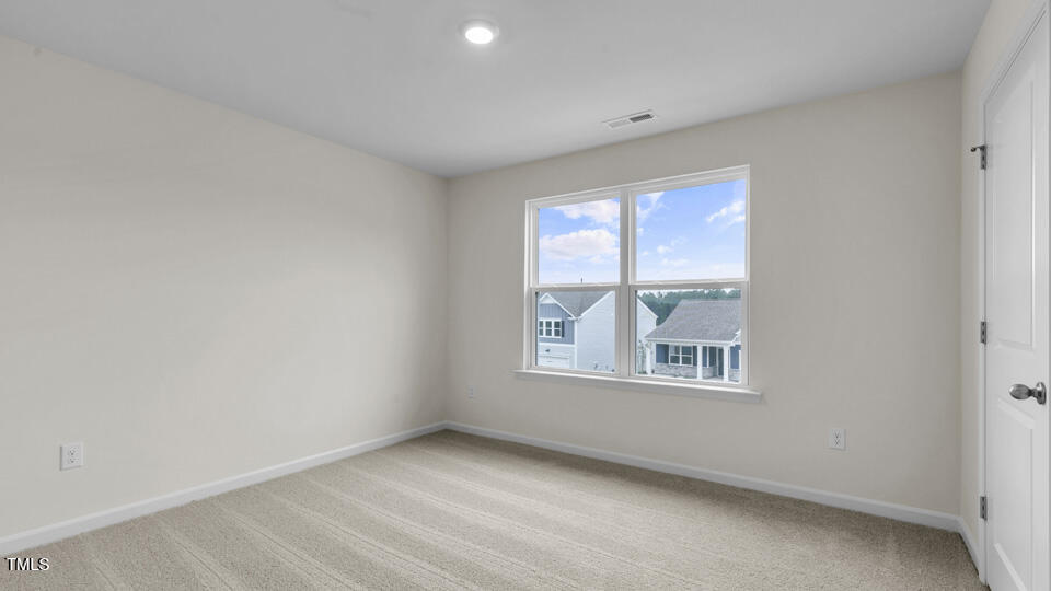 818 Comice Pear Way Willow Spring, NC 27592 - Photo 29 of 44 an empty room with windows