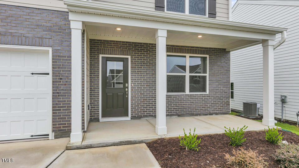 818 Comice Pear Way Willow Spring, NC 27592 - Photo 3 of 44 a front view of a house