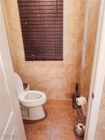 a bathroom with a toilet and a sink