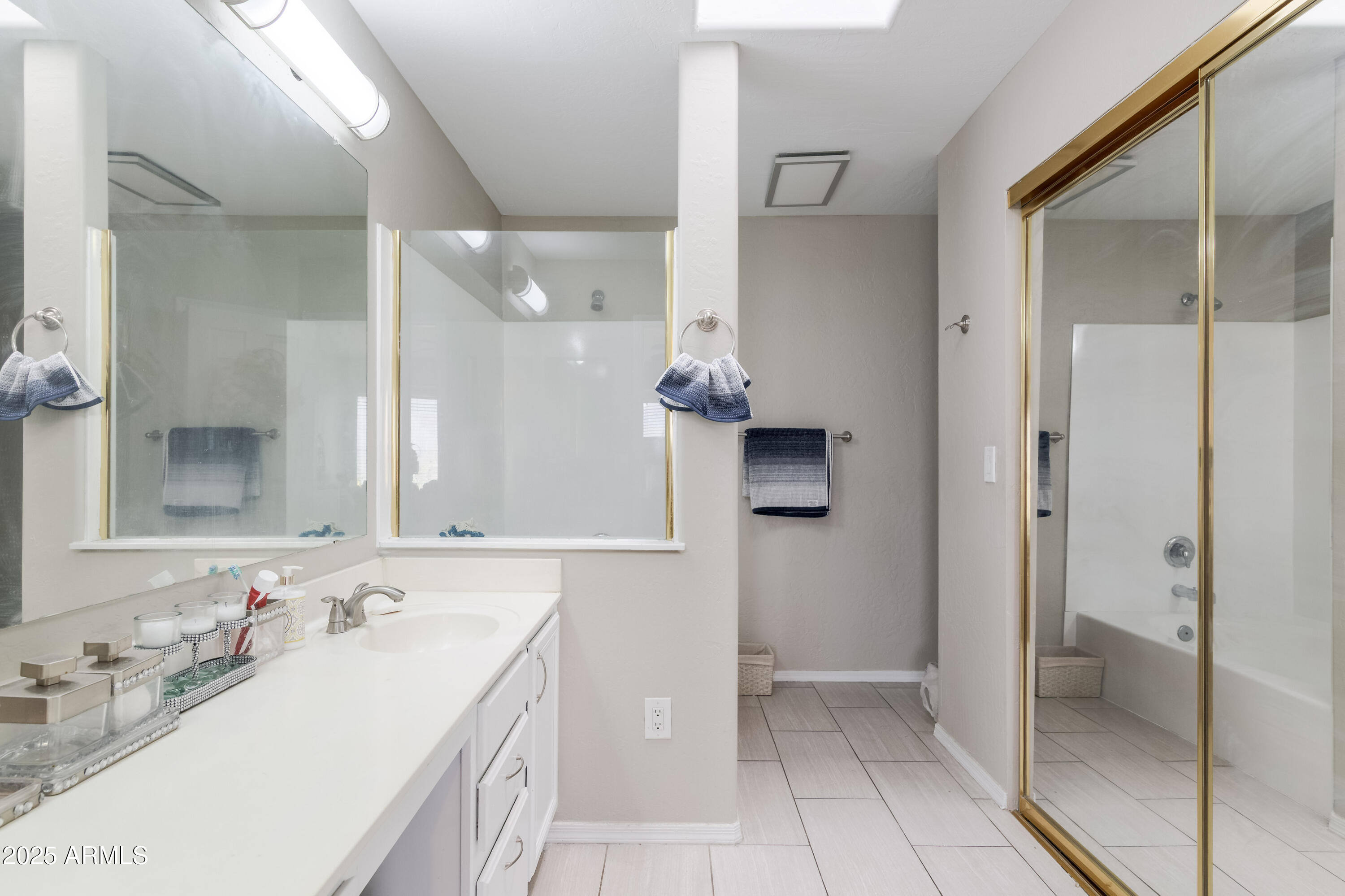 3755 East Broadway Road, Unit 36 Mesa, AZ 85206 - Photo 14 of 24 a bathroom with a double vanity sink and mirror
