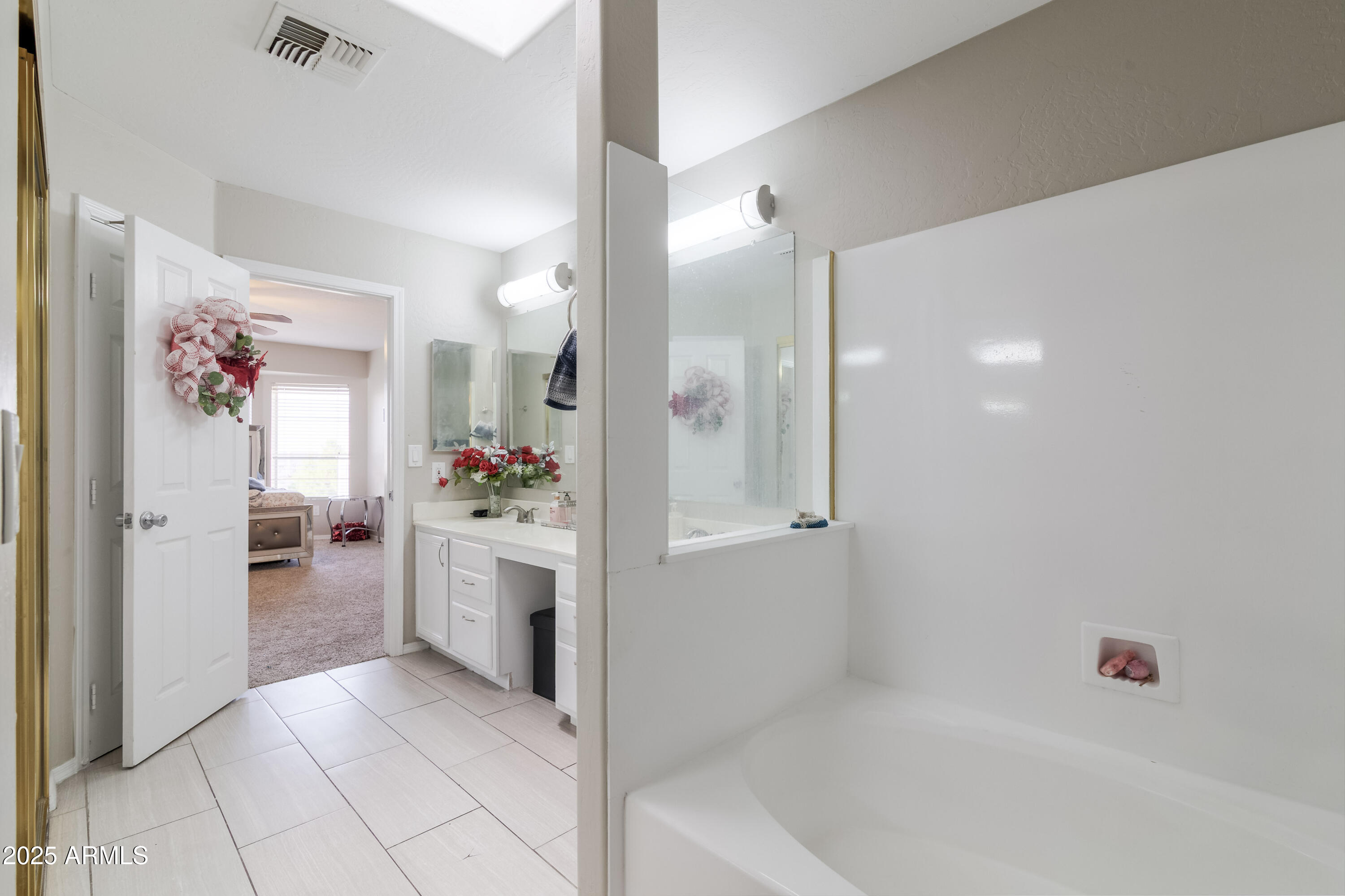 3755 East Broadway Road, Unit 36 Mesa, AZ 85206 - Photo 15 of 24 a bathroom with a bathtub sink and shower