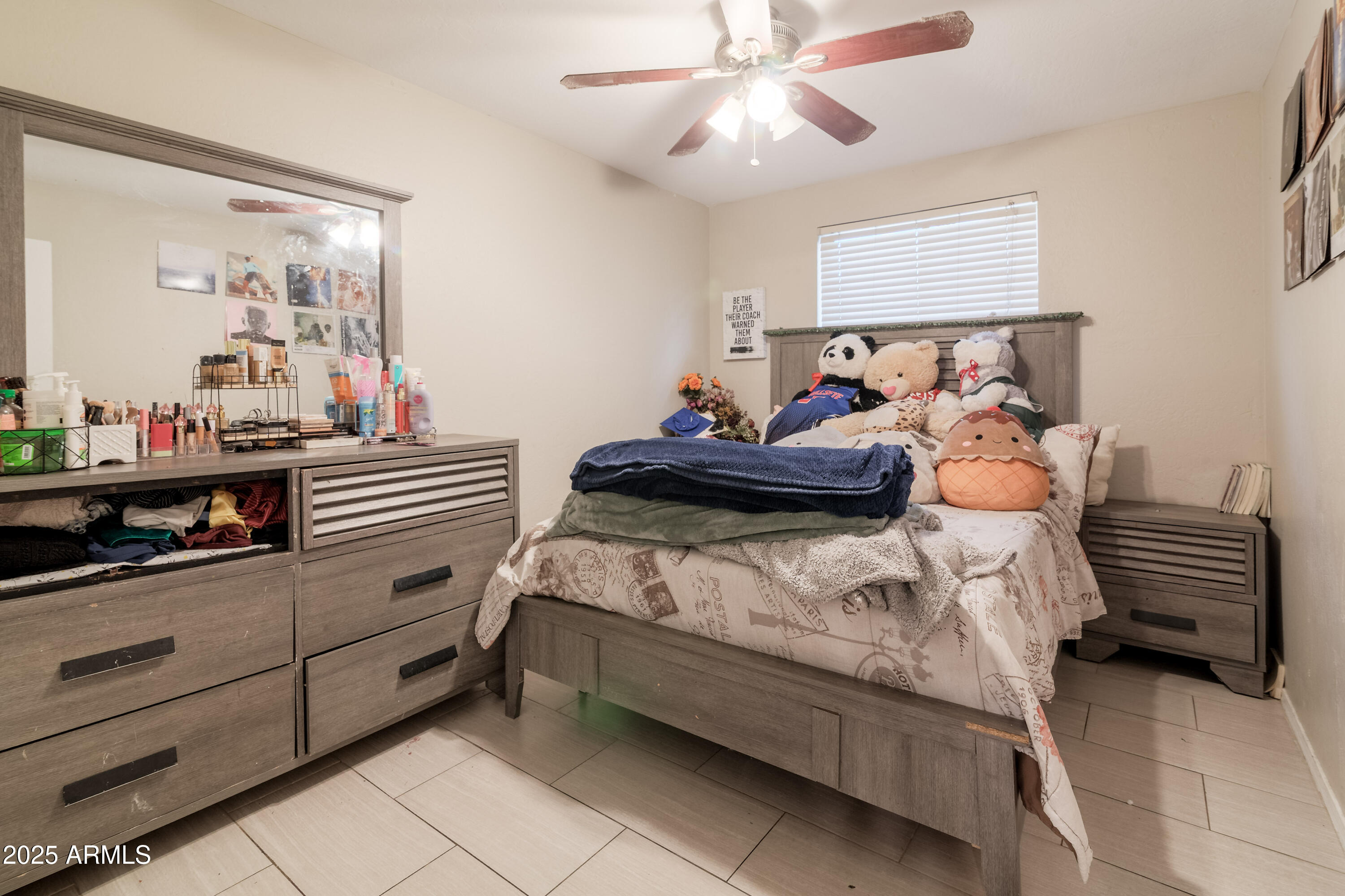 3755 East Broadway Road, Unit 36 Mesa, AZ 85206 - Photo 17 of 24 a bedroom with a bed and a chandelier