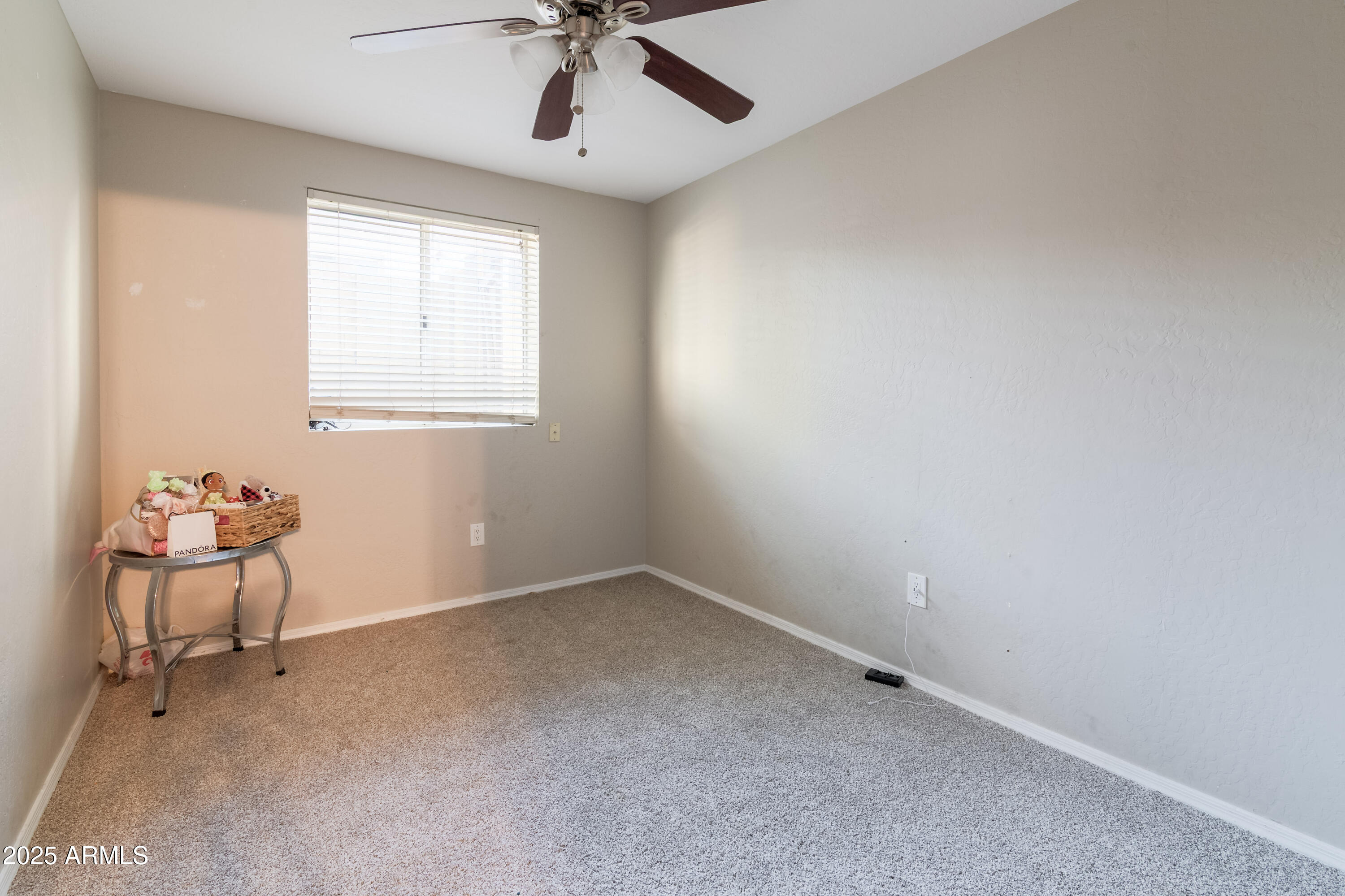 3755 East Broadway Road, Unit 36 Mesa, AZ 85206 - Photo 19 of 24 an empty room with windows and fan