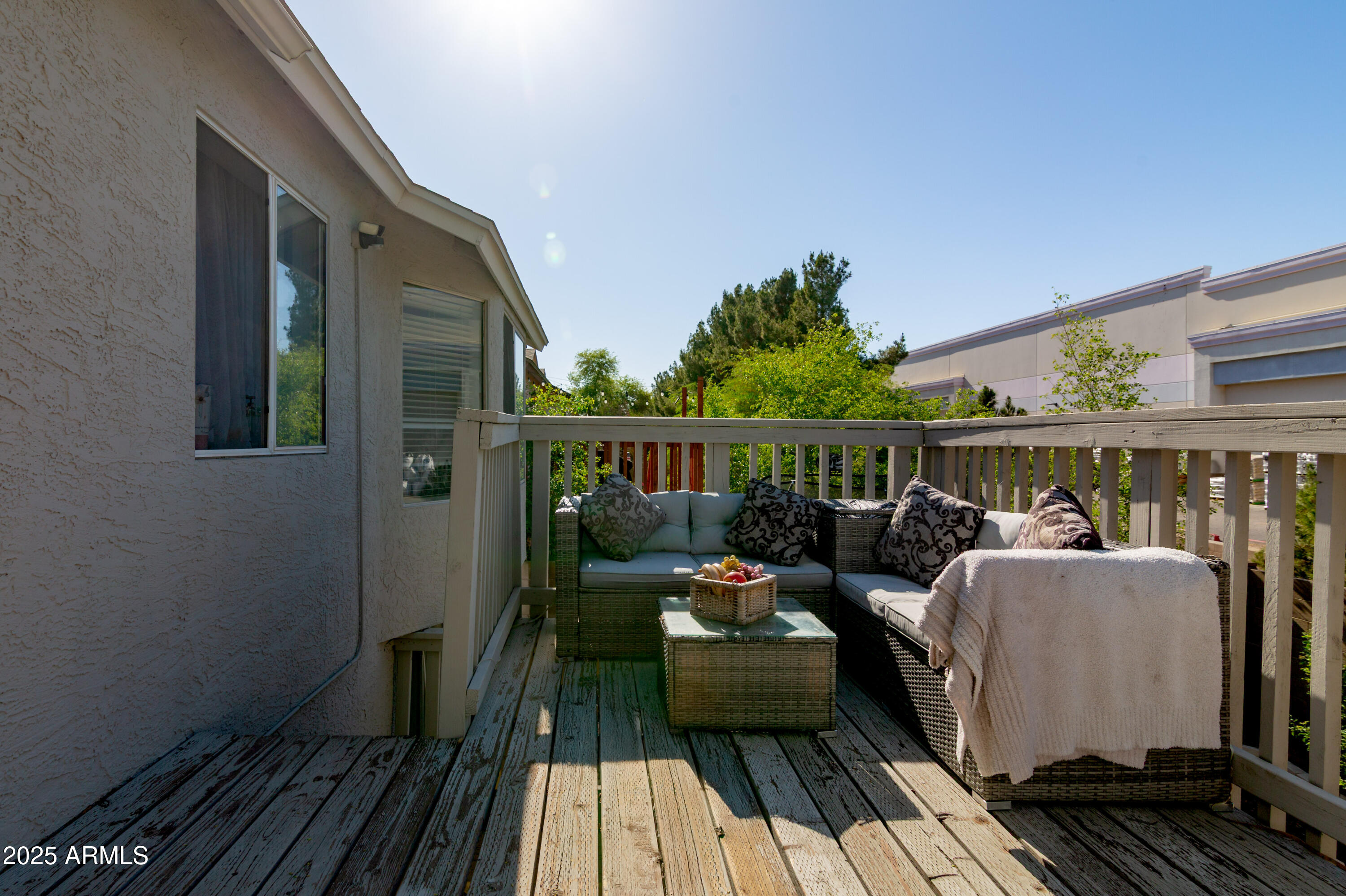 3755 East Broadway Road, Unit 36 Mesa, AZ 85206 - Photo 21 of 24 a view of balcony with wooden floor and seating space