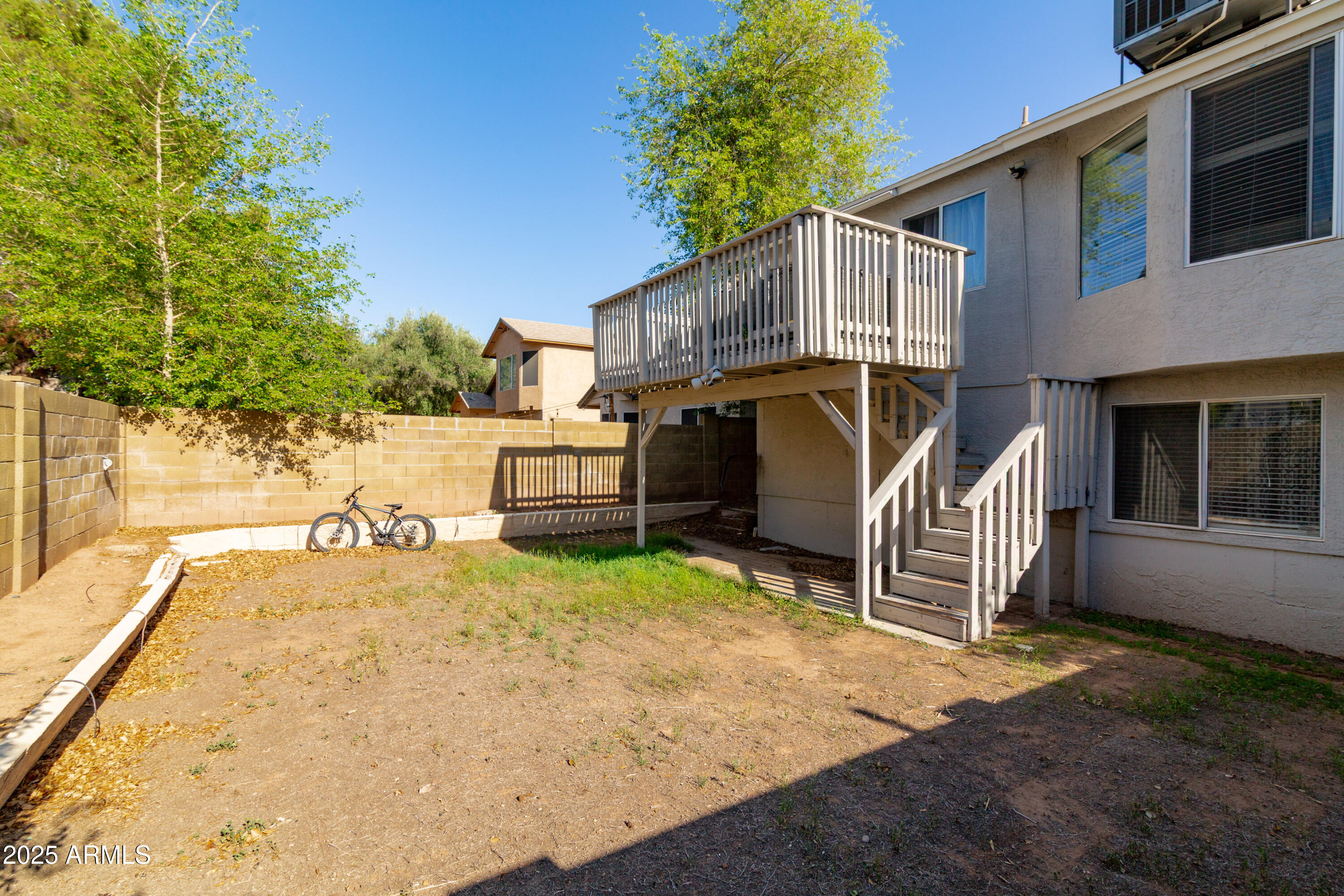 3755 East Broadway Road, Unit 36 Mesa, AZ 85206 - Photo 24 of 24 a view of a house with a yard and furniture